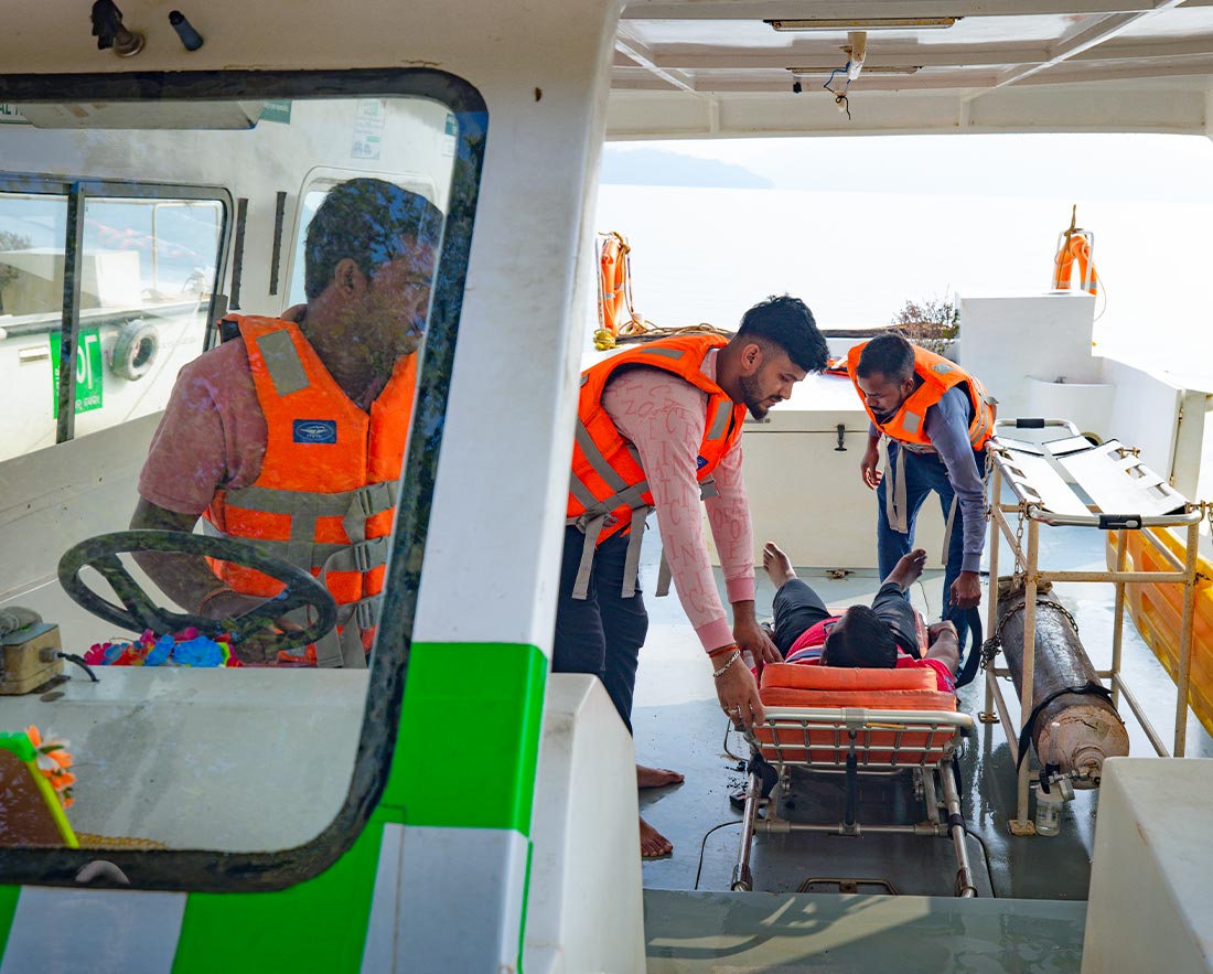 Rescue team assisting injured person on stretcher